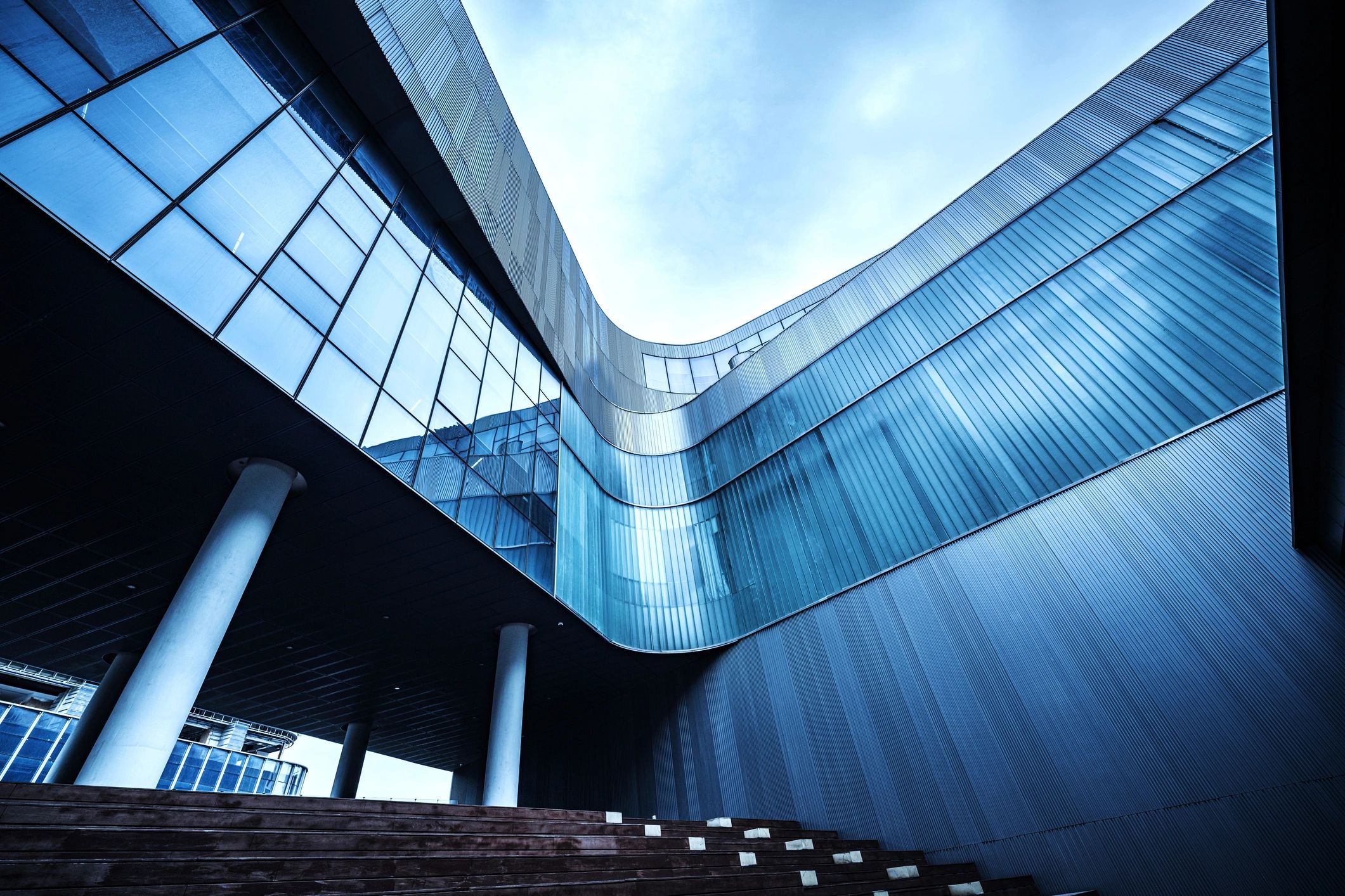 Modern blue architecture representing reliable infrastructure and hosting.
